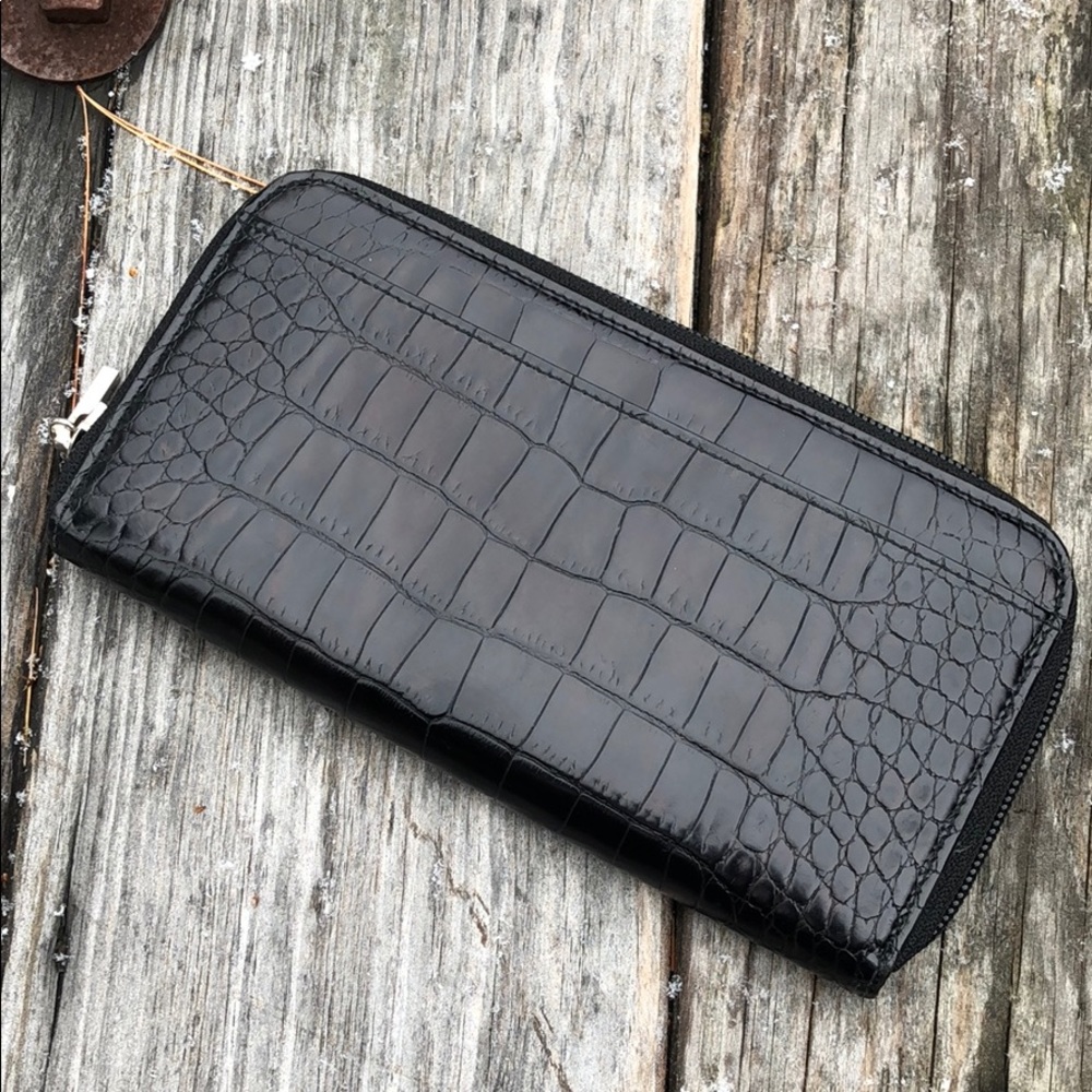 Black leather Saks Fifth Avenue wallet.
